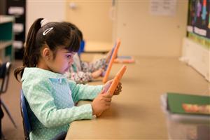 Preschool students explore technology on iPads Preschool students explore technology on iPads
